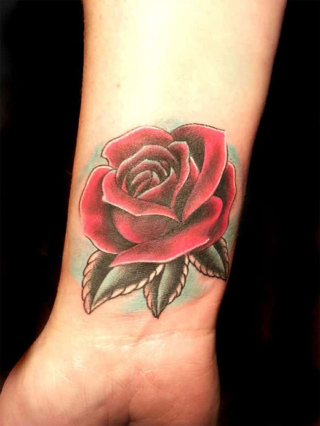 latest-rose-cover-up-tattoo-on-wrist-for-girls