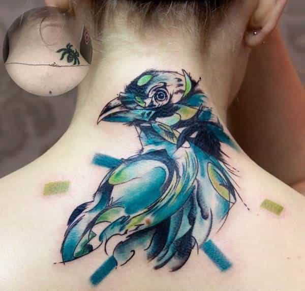 watercolor-bird-upper-back-cover-up-tattoo-for-women