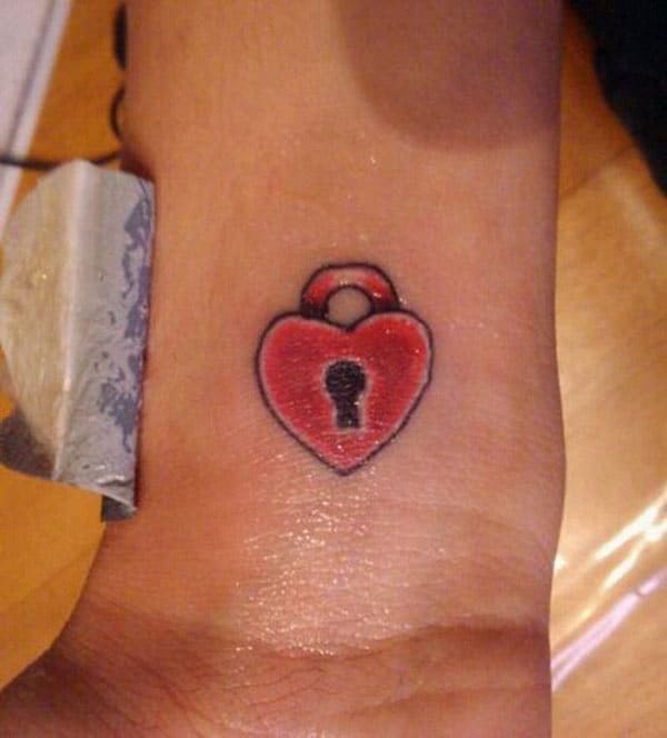 Heart Lock Tattoo Designs - 85+ Best Lock and Key Tattoos - Designs & Meanings 2019 / Designs include tribal hearts, sacred hearts, realistic hearts, winged hearts, locket hearts and many more.