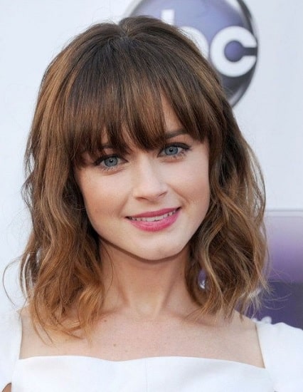 wavy weave hairstyles with arched bangs for women