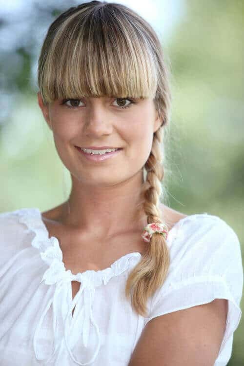 blonde braid with thick bangs