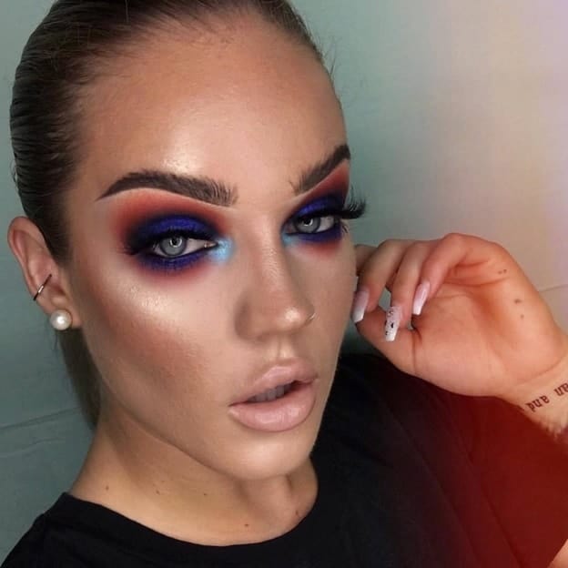 dark tone makeup with blue eyes